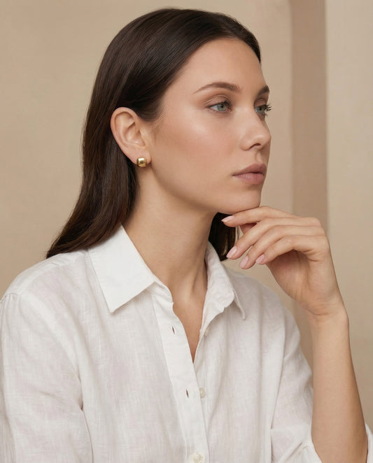 Aurelia Huggie Earrings worn on ear