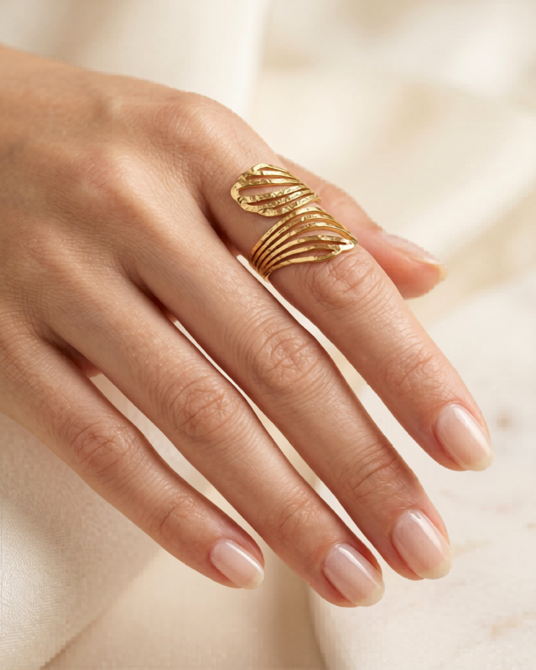 The Helix Ring by Clarabelle draws the eye upward with its elongated open-line structure