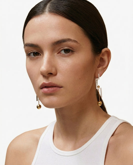 Naxos Geometric Drop Earrings worn on ear