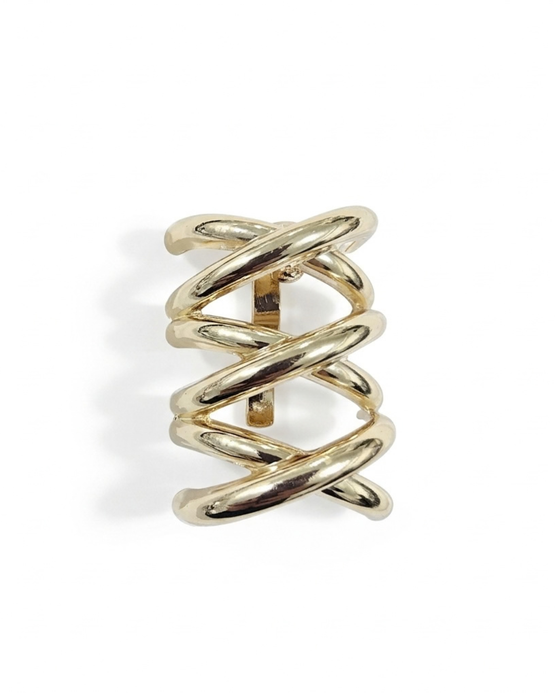 Nova sculptural hair barrette in polished gold-tone with woven criss-cross bands, laid flat on neutral background