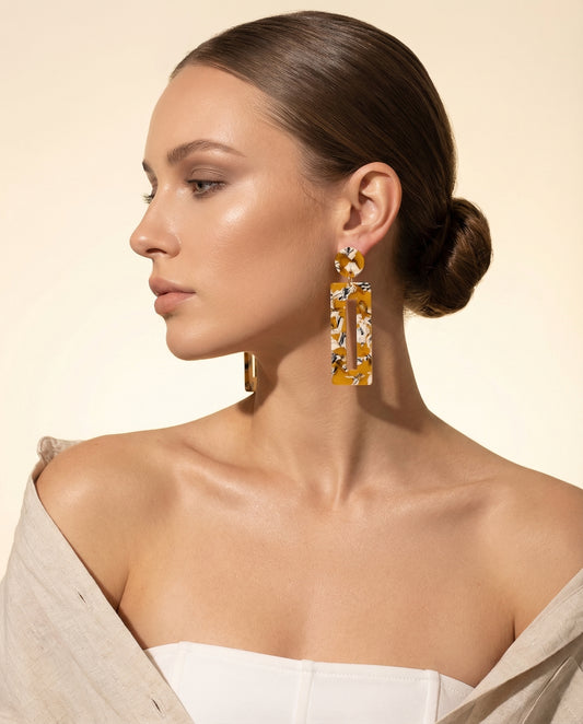 elongated geometric statement earrings with multicolour finish