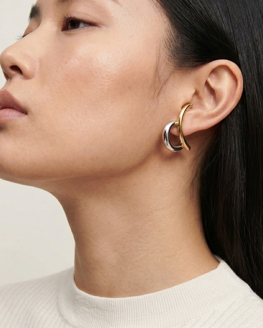 Woman choosing jewellery for herself — Clarabelle self-purchase earrings Moment Collection