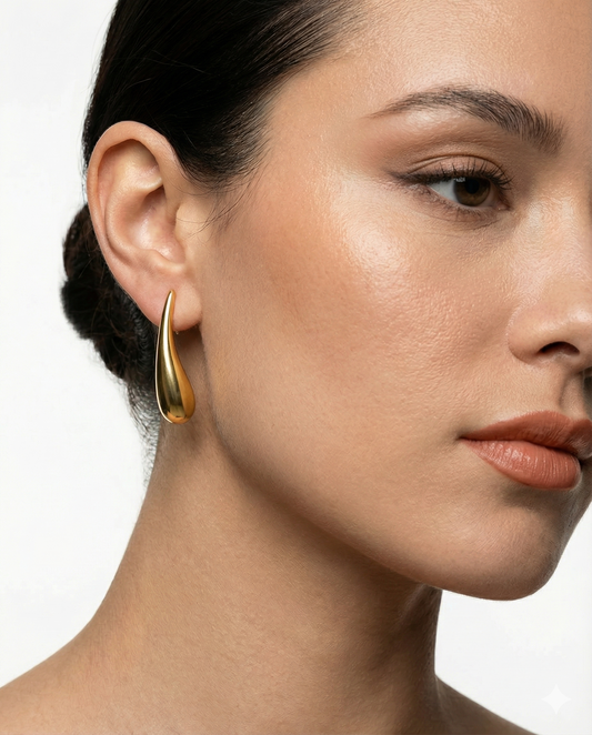 Woman building confidence through jewellery and personal style — Clarabelle gold earrings
