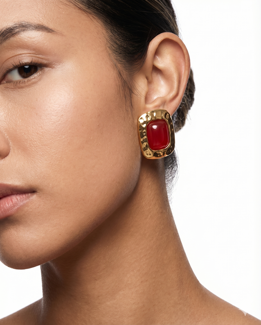 Gold drop earrings completing an elegant look — jewellery styling by Clarabelle