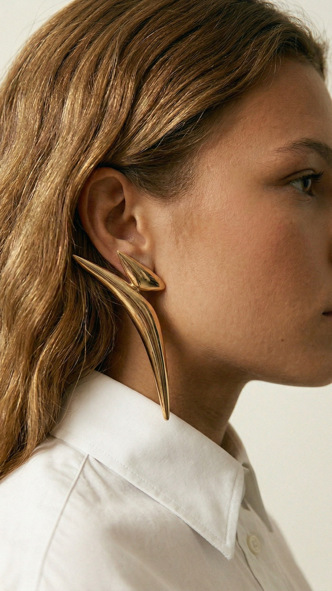 Earrings styled with a white shirt — simple elegant jewellery combinations by Clarabelle