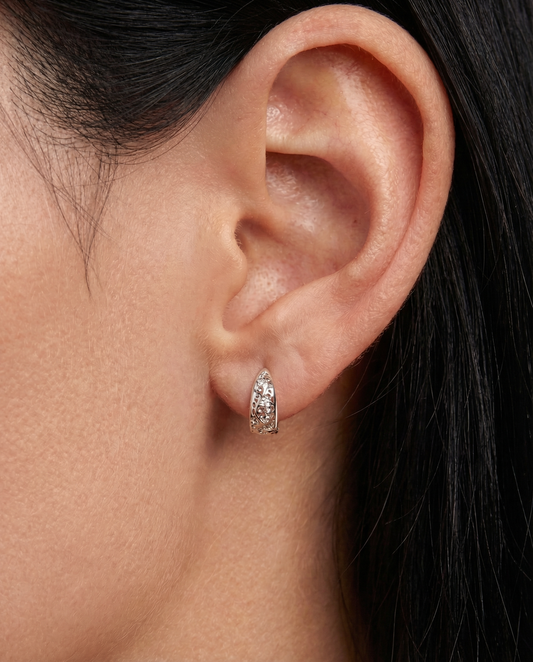 Small elegant earrings with big impact — subtle jewellery styling by Clarabelle