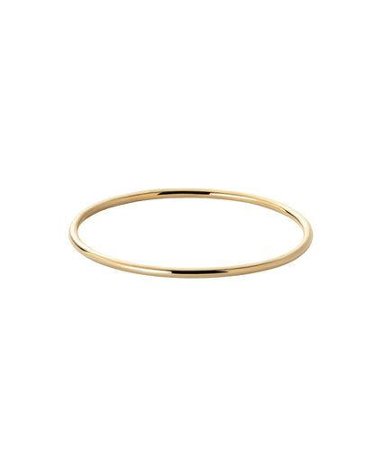 Amélie round bangle by Clarabelle, gold finish slim tubular silhouette