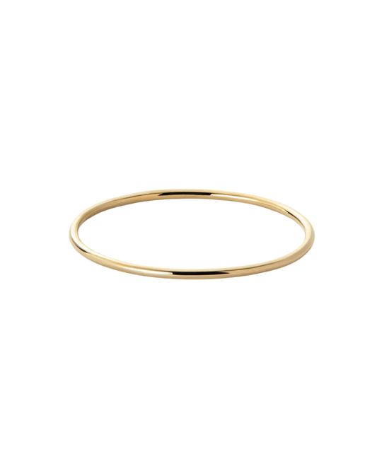 Amélie round bangle by Clarabelle, gold finish slim tubular silhouette