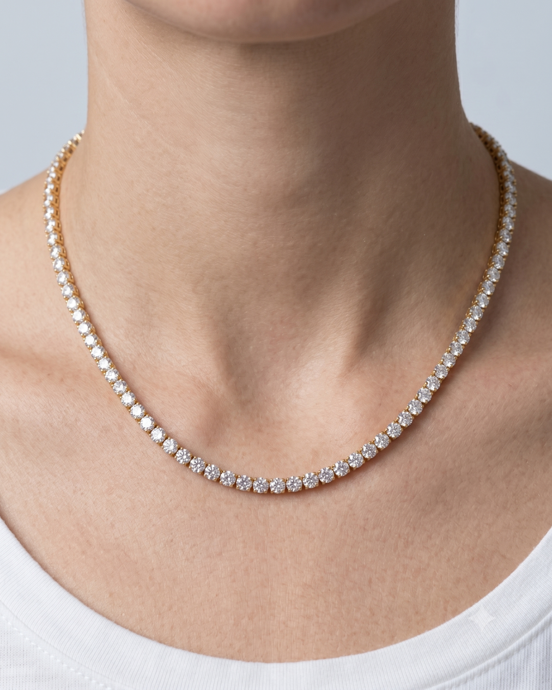 Close-up of stones: Close-up of Margaux tennis necklace, 3mm AAA zircon stones in claw-set 18k gold plated settings