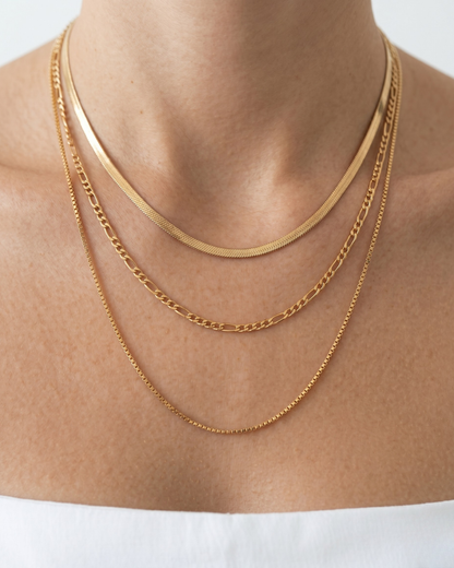 Gold electroplated stainless steel triple layer necklace with herringbone figaro and box chains by Clarabelle