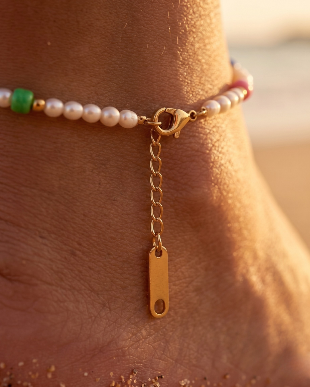 Maldives Anklet 18K Gold Plated close-up detail showing lobster clasp gold extender chain and stainless steel tag on ankle