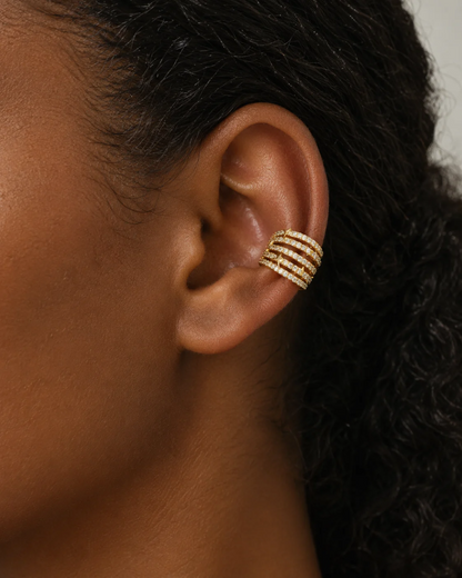 Model wearing the Esme pavé ear cuff clipped on the lower ear with hair tucked back