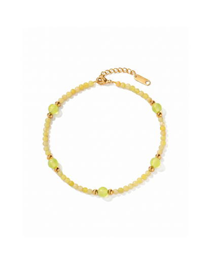 18K gold plated titanium steel anklet with yellow and green stone-effect beads and gold sphere accents by Clarabelle