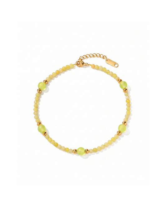 18K gold plated titanium steel anklet with yellow and green stone-effect beads and gold sphere accents by Clarabelle
