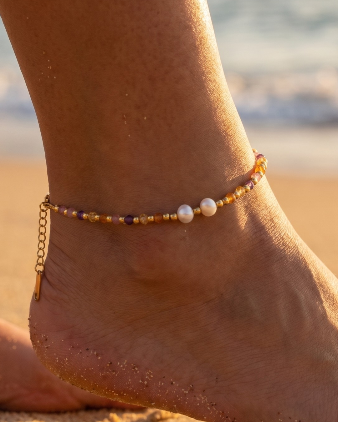 Havana Anklet 18K Gold Plated with freshwater pearl and amber purple beads on sun-kissed ankle at beach golden hour