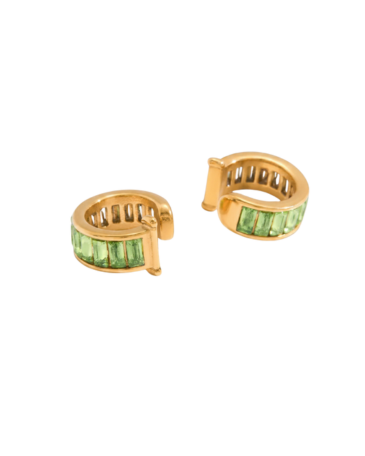 Léonie Green Huggie Earrings on a white background