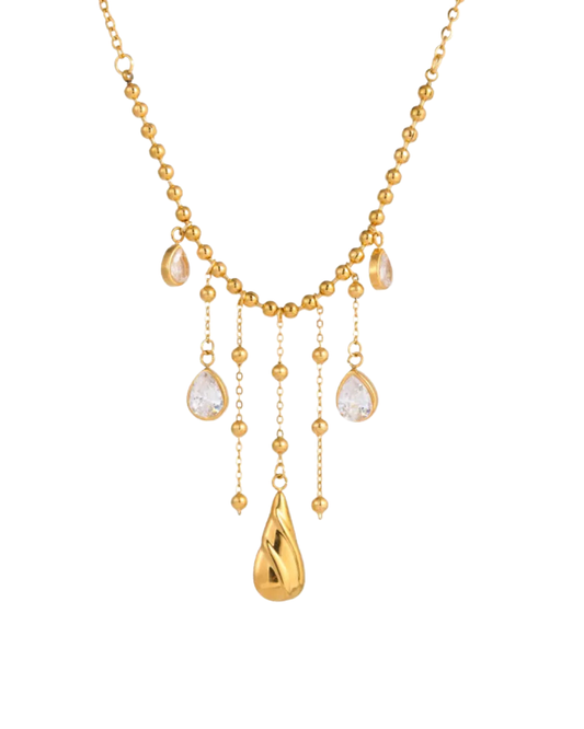 Gold PVD stainless steel ball chain necklace with stone-effect water drop tassel pendants and sculptural gold drop, displayed on white background — Medellín Necklace by Clarabelle