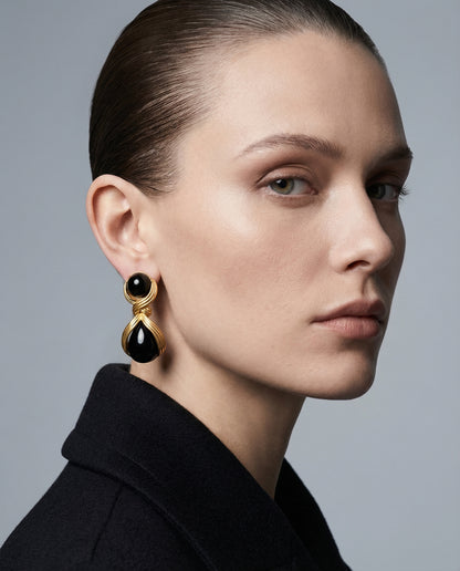 Model wearing Luna Black Statement Drop Earrings by Clarabelle — gold and black earrings