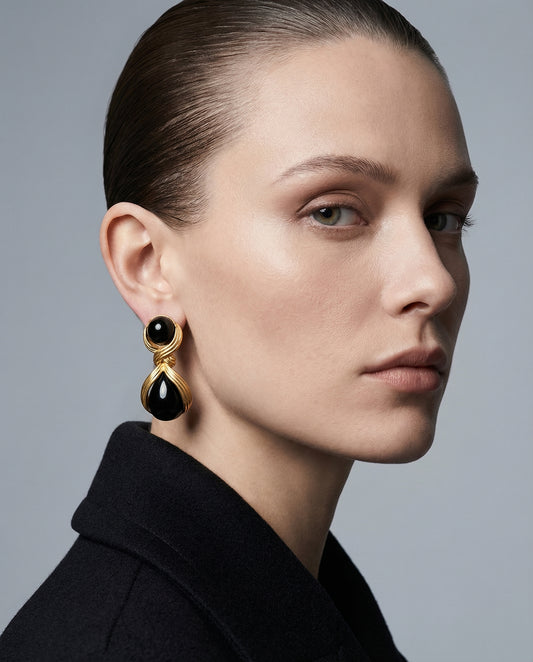 Model wearing Luna Black Statement Drop Earrings by Clarabelle — gold and black earrings