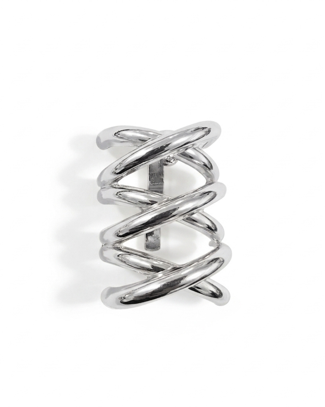 Nova sculptural hair barrette in polished silver-tone with woven criss-cross bands, laid flat on neutral background
