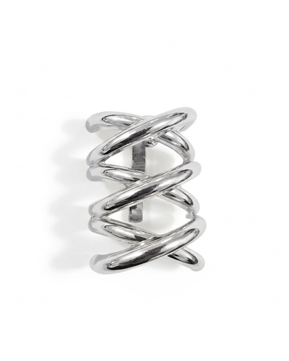 Nova sculptural hair barrette in polished silver-tone with woven criss-cross bands, laid flat on neutral background