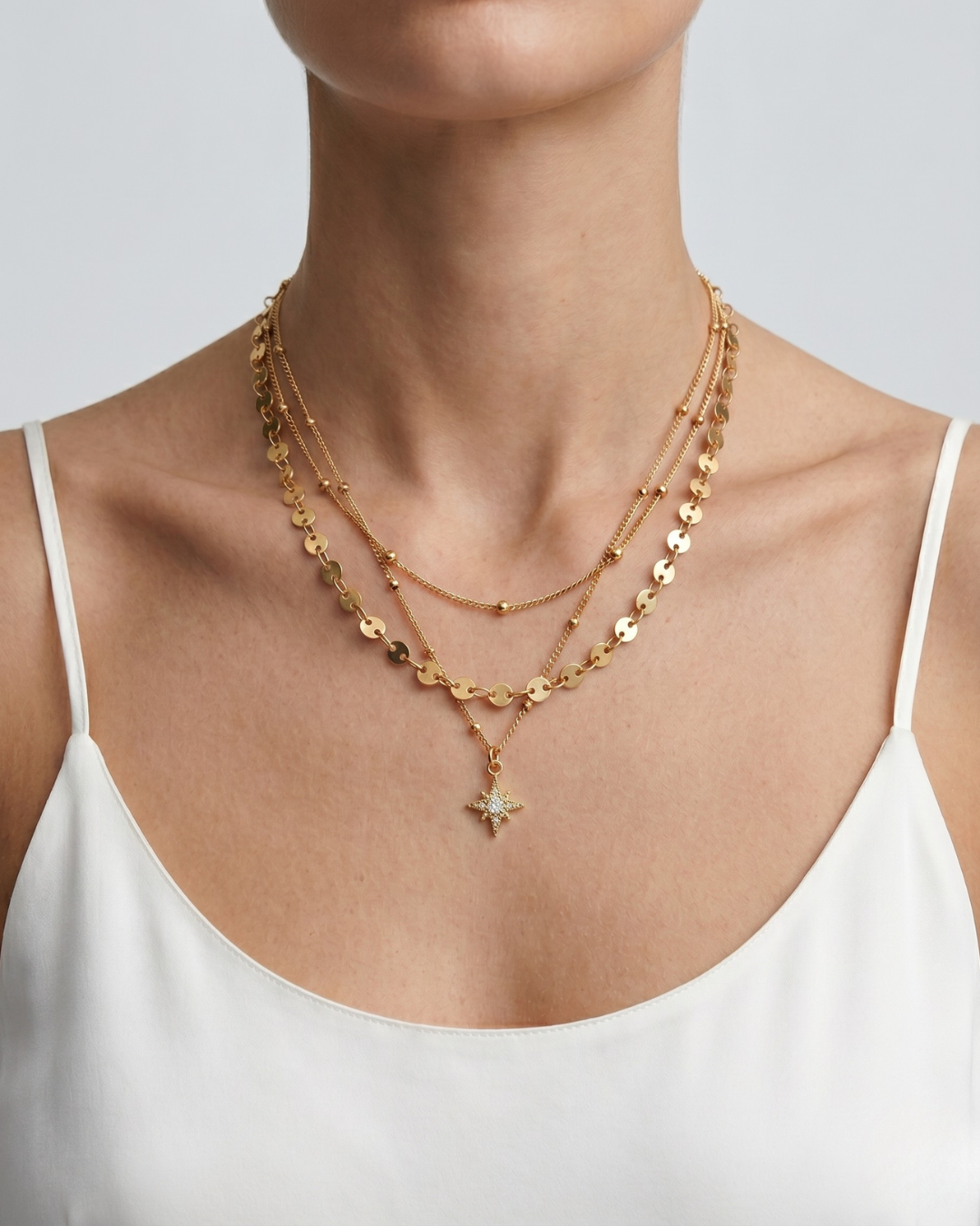 Gold plated stainless steel triple layer necklace with faceted bead chain and octagonal star charm pendant by Clarabelle