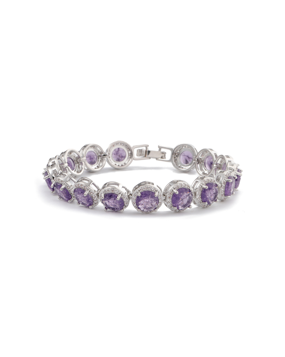 Zaira halo tennis bracelet with round amethyst purple zircon stones and clear pavé crystal halos on silver-tone plating, laid flat on neutral background