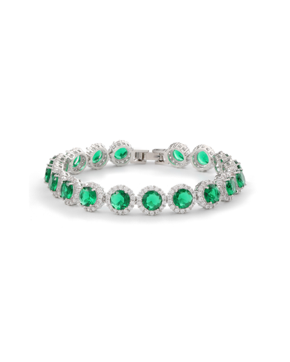Zaira halo tennis bracelet with round emerald green zircon stones and clear pavé crystal halos on silver-tone plating, laid flat on neutral background