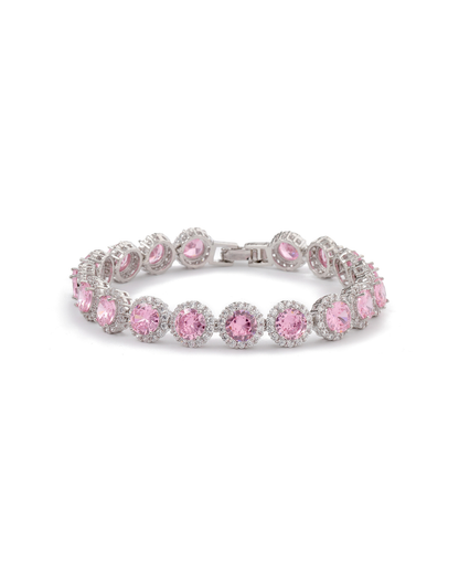 Zaira halo tennis bracelet with round rose pink zircon stones and clear pavé crystal halos on silver-tone plating, laid flat on neutral background