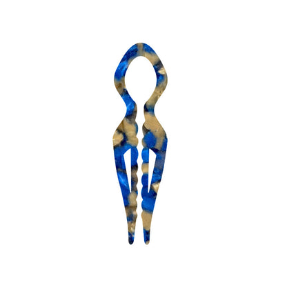 Margot sculpted acetate hair fork in blue marble with lyre silhouette and two tapered tines, laid flat on neutral background