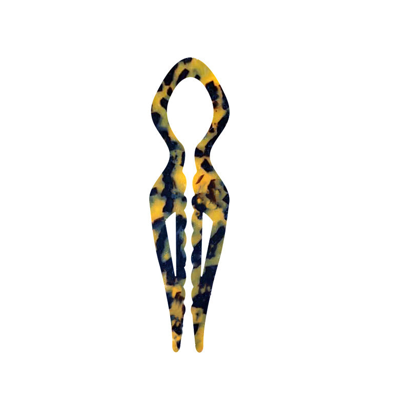 Margot sculpted acetate hair fork in dark tortoise with lyre silhouette and two tapered tines, laid flat on neutral background
