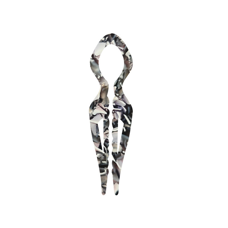 Margot sculpted acetate hair fork in grey floral pattern with lyre silhouette and two tapered tines, laid flat on neutral background