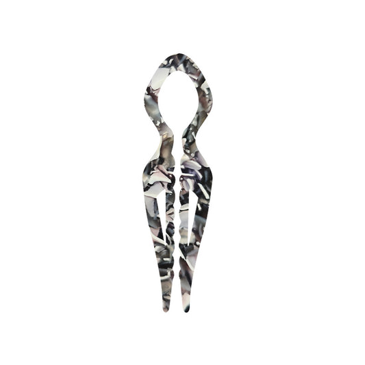 Margot sculpted acetate hair fork in grey floral pattern with lyre silhouette and two tapered tines, laid flat on neutral background
