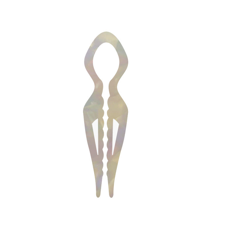 Margot sculpted acetate hair fork in iridescent mermaid white with lyre silhouette and two tapered tines, laid flat on neutral background