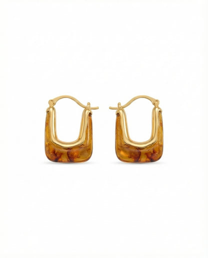 modern gold sculptural hoop earrings with marbled resin detail