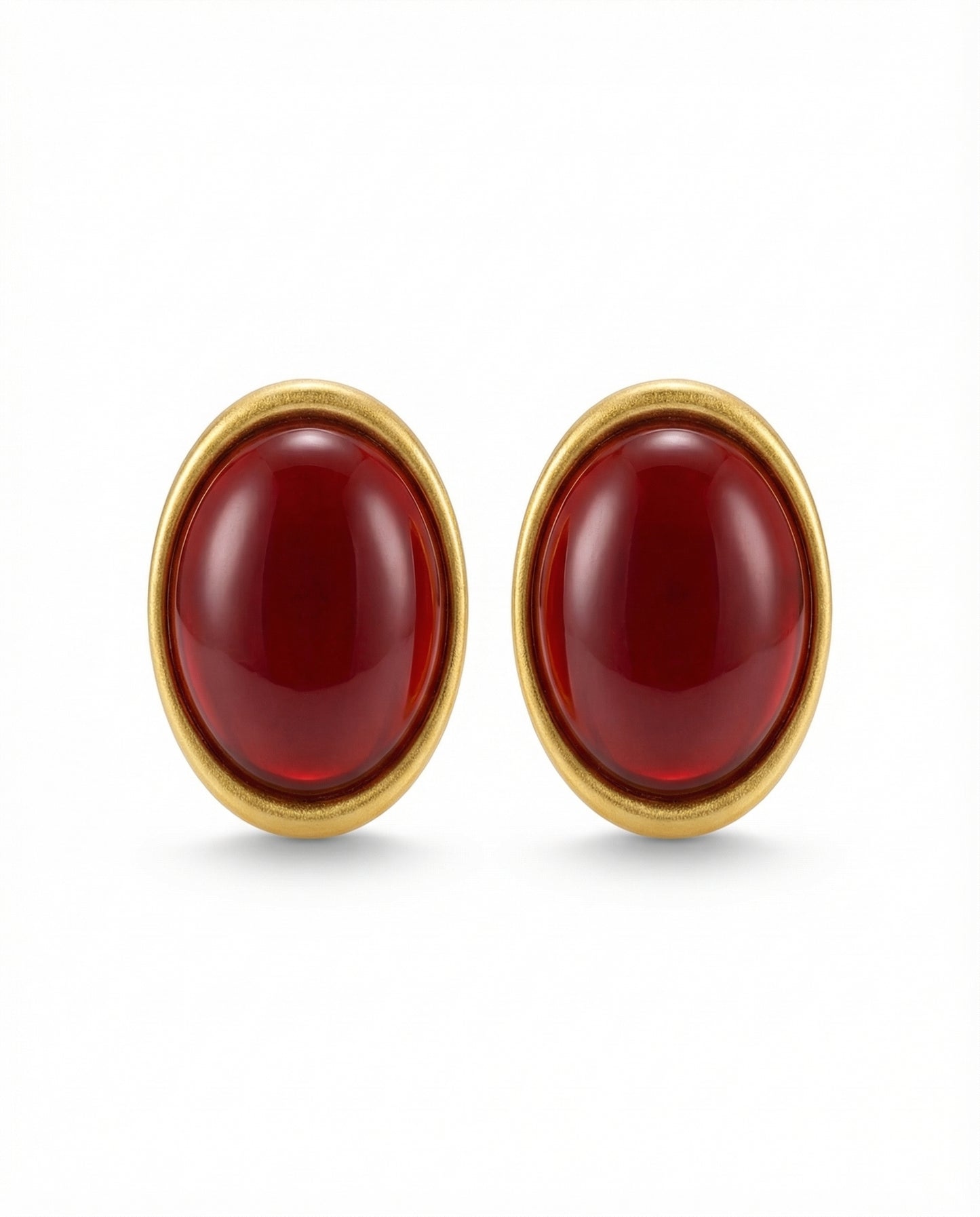 oval statement earrings with domed centre and gold-tone frame